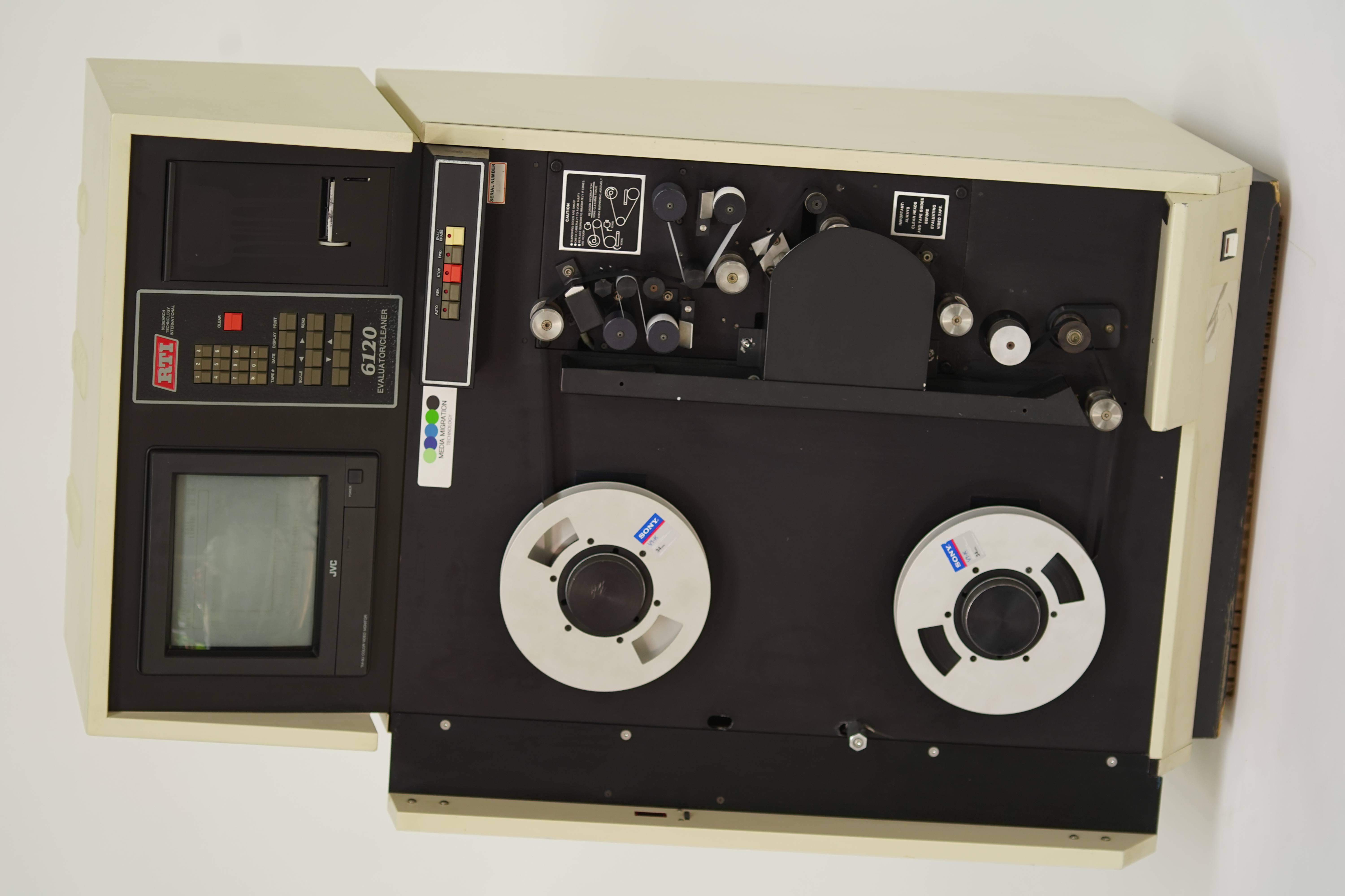 TapeChek 6120CL 1-inch broadcast cleaner — overhead view with reels